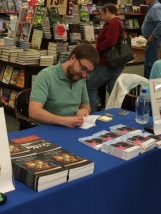 Novelist Randal Eldon Greene signing his book Descriptions of Heaven at Barnes & Noble in Sioux City, Iowa.